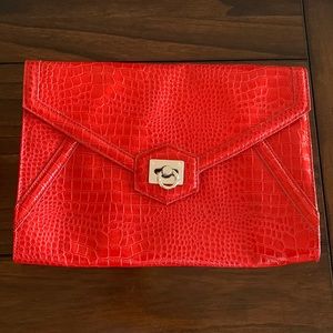 Faux croc orange envelope clutch with optional chain shoulder strap.